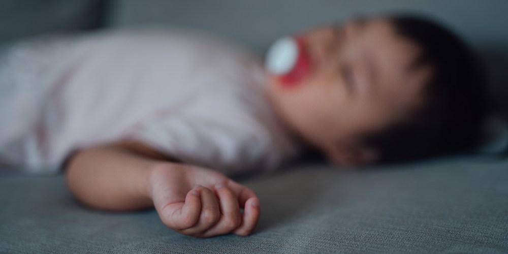 A sleeping baby, out of focus.