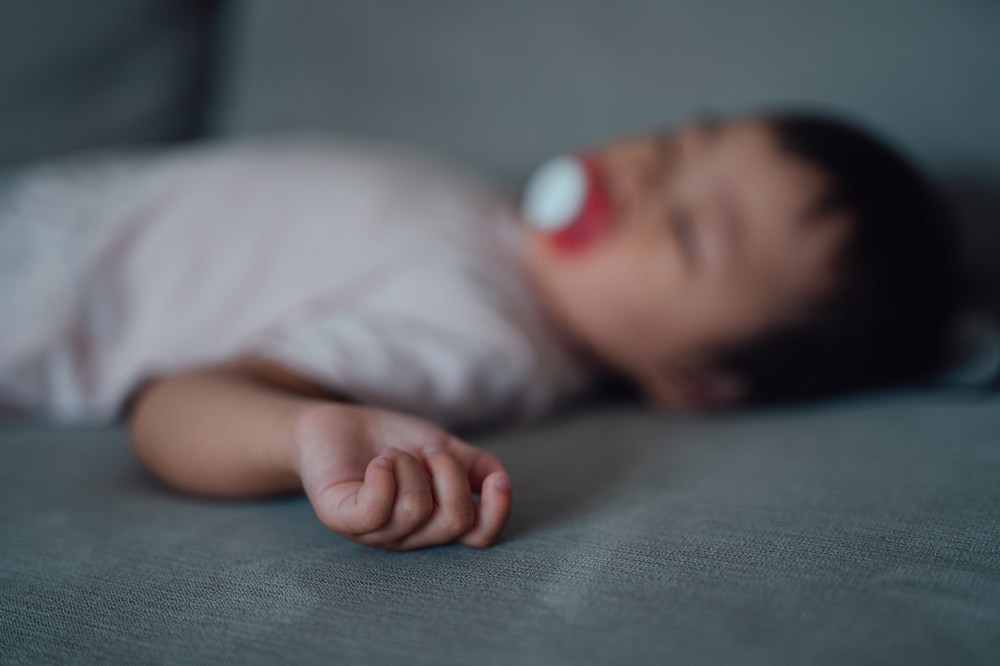 A sleeping baby, out of focus.