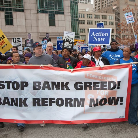 Unions, religious groups and community organizations in Chicago rally outside the conference of the American Bankers Association.