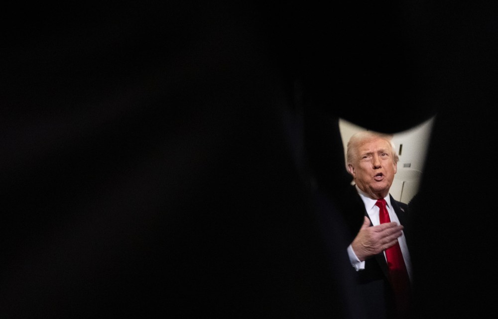 President Trump speaks to reporters on Air Force One.