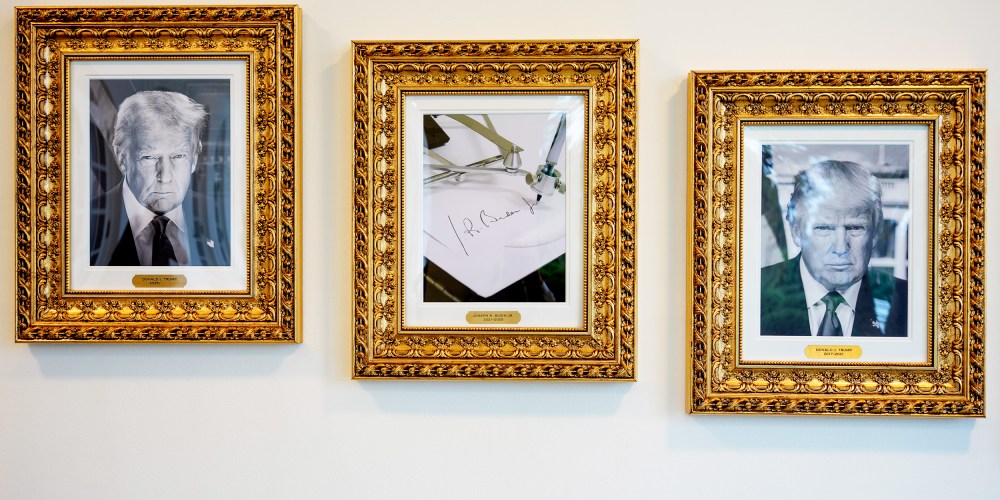 Framed portraits of President Donald Trump flank an image of former President Joe Biden's signature and an autopen along "The Presidential Walk of Fame" at the White House.