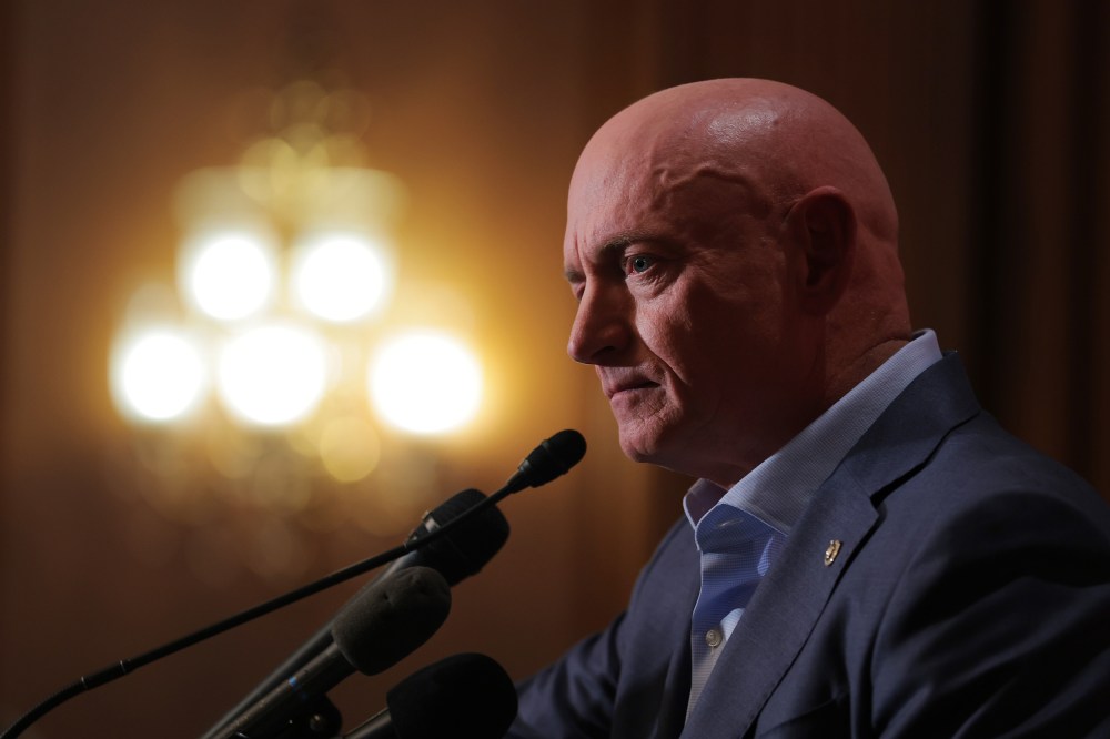 Sen. Mark Kelly speaks at a news conference in the Capitol.