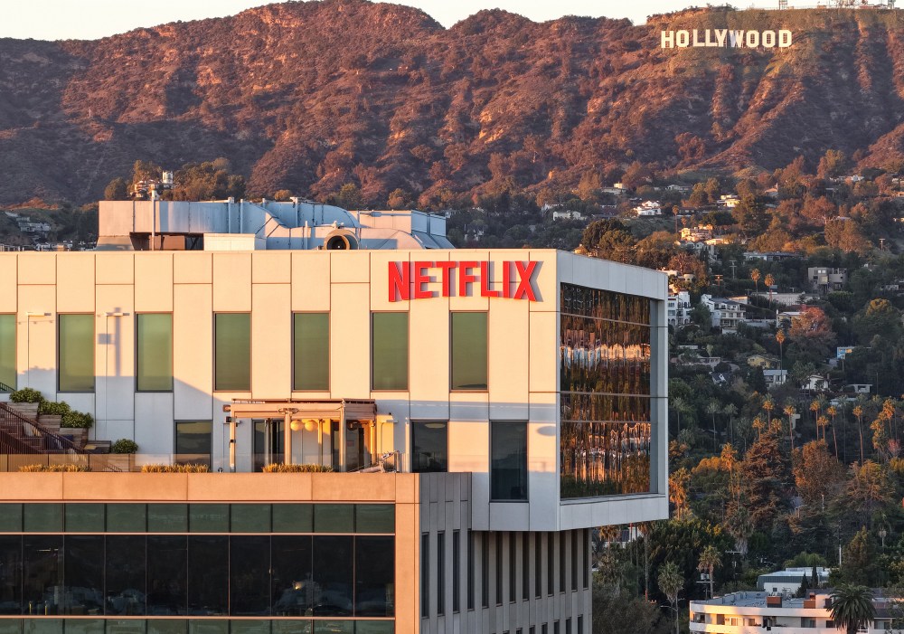 An aerial view of the Netflix logo displayed at Netflix studios, with the Hollywood sign in the distance, on Dec. 5, 2025, in Los Angeles.