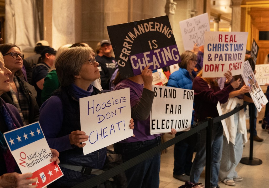 Demonstrators protest at the Indiana Statehouse in Indianapolis, I.N., on Dec. 11, 2025.