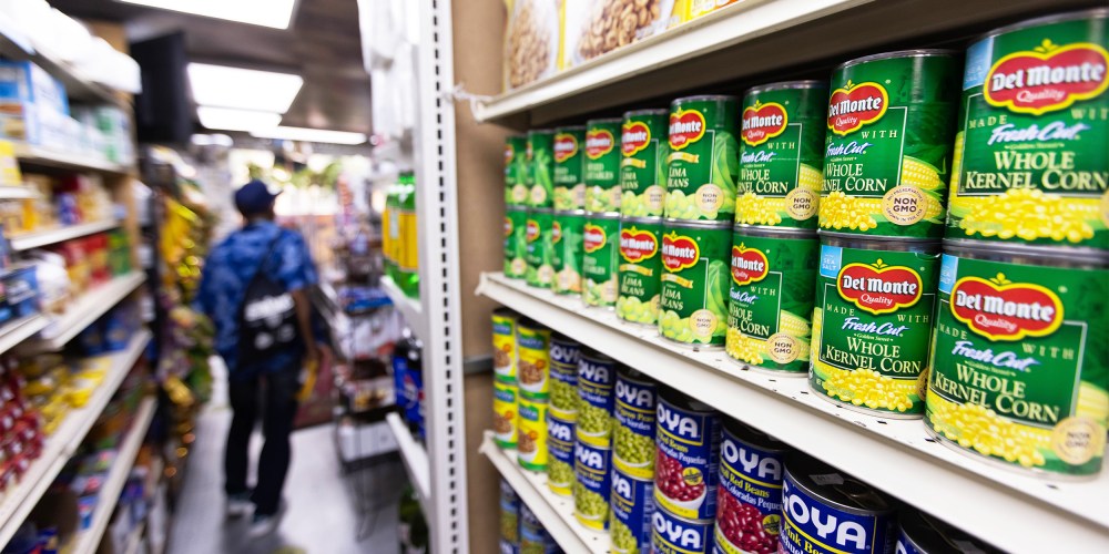 Canned food and other products in an aisle at a grocery store in NY
