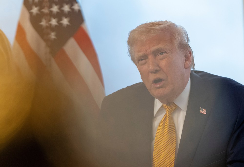 President Donald Trump speaks during a call with service members at his Mar-a-Lago club on Dec. 24, 2025, in Palm Beach, FL.