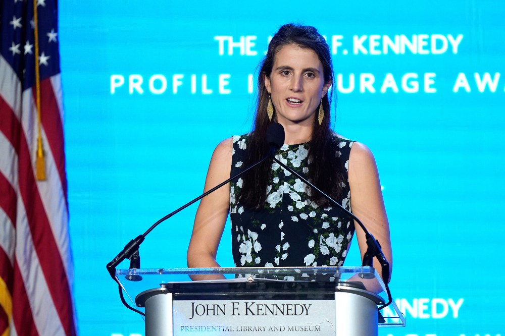 Tatiana Schlossberg speaks at a podium.