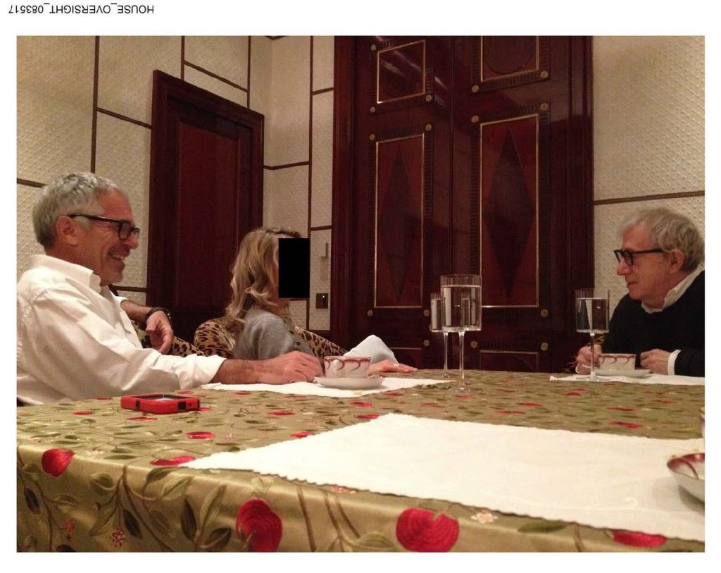 Jeffery Epstein and Woody Allen are seen at a table with an unnamed woman