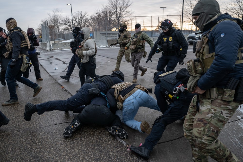 Federal law enforcement officers detain a demonstrator during a protest outside the Bishop Henry Whipple Federal Building in St. Paul, Minnesota, on Saturday, Jan. 17, 2026.