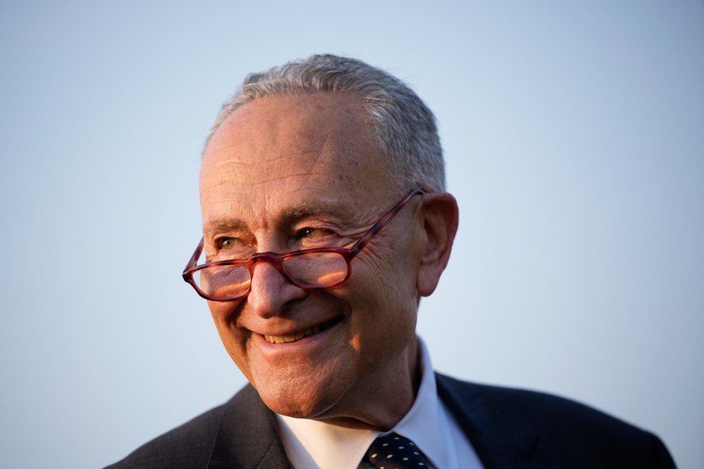 Chuck Schumer smiles.