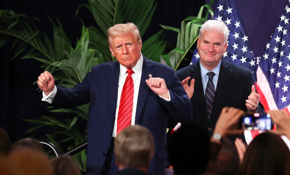 U.S. President Donald Trump dances as House Majority Whip Tom Emmer applauds on Jan. 27, 2025 in Doral, FL.