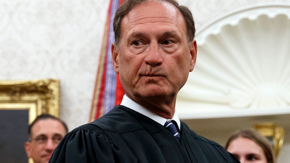 Justice Alito seen in the Oval Office. His face looks nervous.