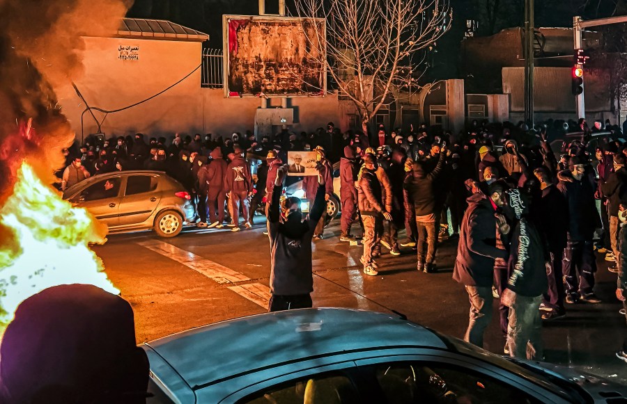Iranians gather while blocking a street during a protest on Jan. 9, 2026 in Tehran.