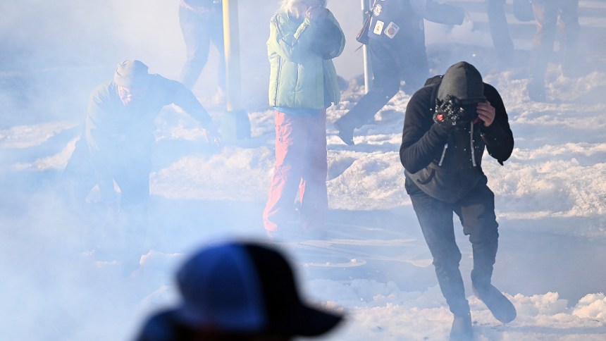 Federal agents clash with residents and rapid responders as they deploy tear gas in Minneapolis, MN.