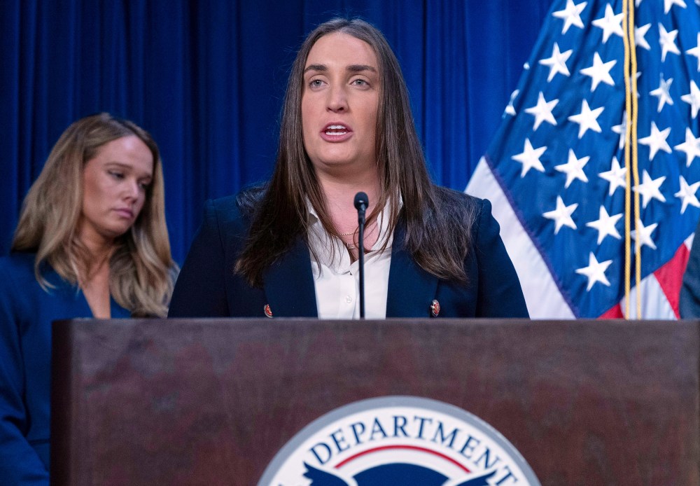 Madison Sheahan speaks at the podium, seen in a tight frame.