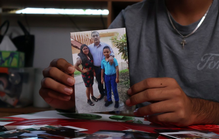 Arnoldo carried this photograph of himself, his father, and one of his sisters, Selena, with him to the hospital.