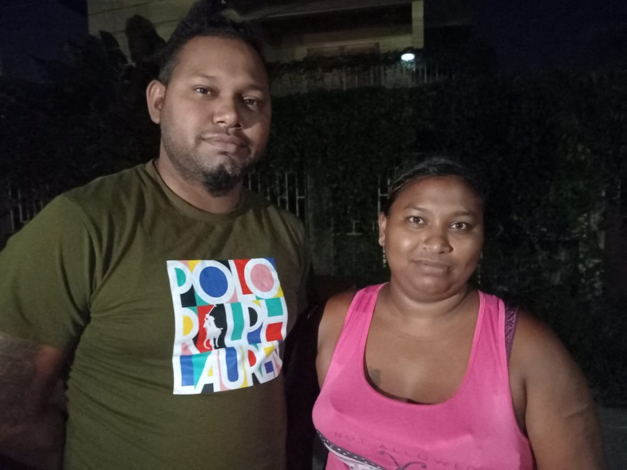 Brandon Wills, left, and Sallycar Korasingh pose together for a photo.