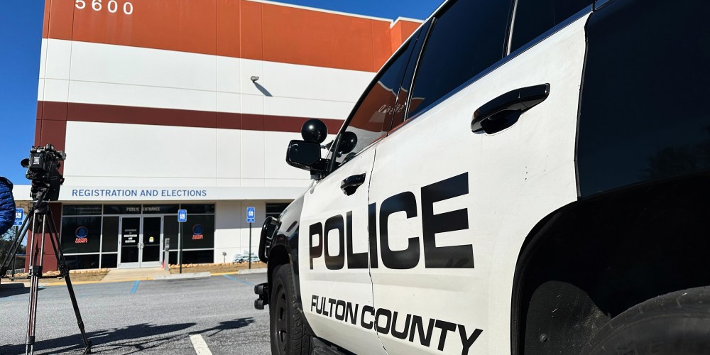 Police vehicles are seen outside the Fulton County elections hub on Jan. 28, 2026, in Union City, Ga.