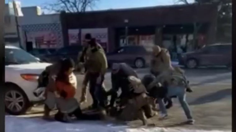 Federal agents shove man