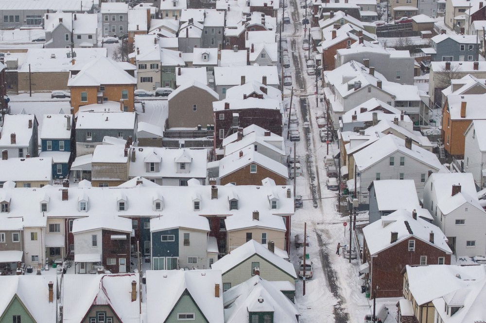 An aerial view of snow-covered homes.