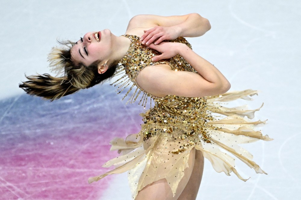 Alysa Liu bends backwards, her hands on her chest, while skating during the 2026 Winter Olympics.