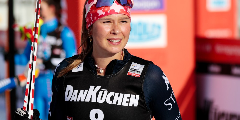 Annika Malacinski smiles with her ski outside.