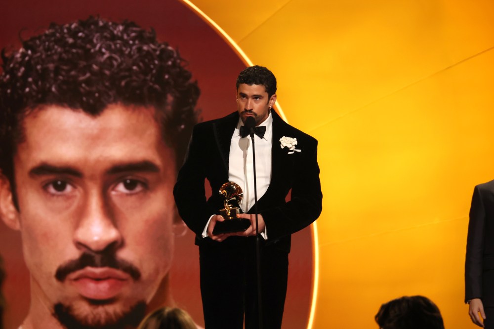 Bad Bunny stands on stage with Grammy Award in hand.