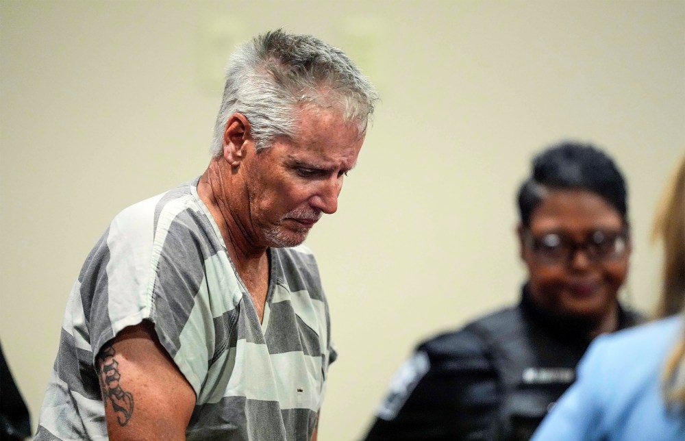 Colin Gray, 54, the father of Apalachee High School shooting suspect Colt Gray, 14, enters the Barrow County courthouse for his first appearance.