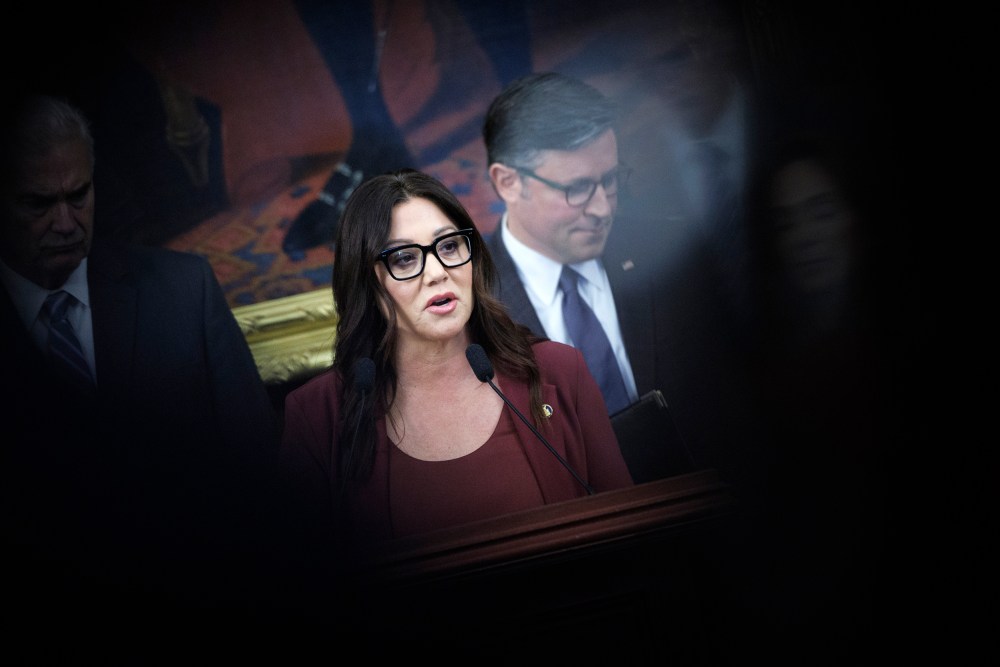 Lori Chavez-DeRemer is surrounded with Republican leaders in a frame partly obscured by a black mark.