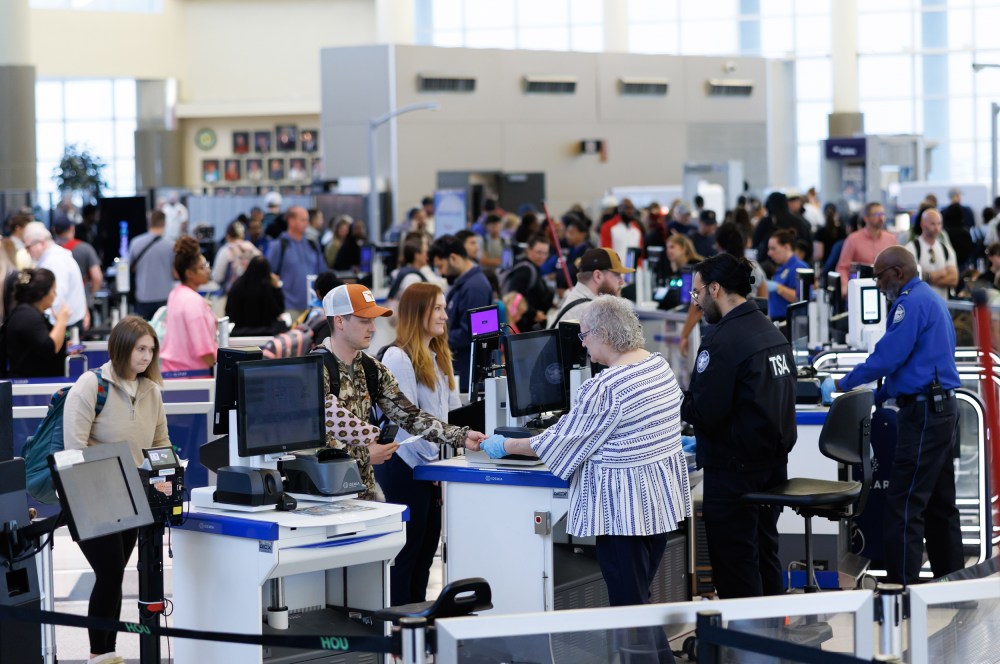 People check in at TSA checkpoint.