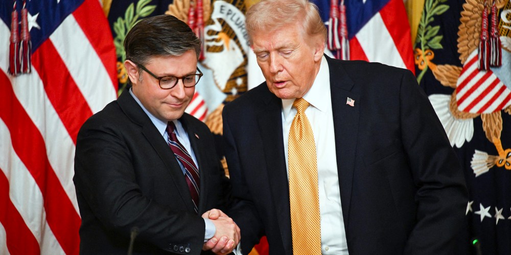 President Donald Trump shakes hands with Speaker of the House Mike Johnson during a lunch with the Kennedy Center Board Members.