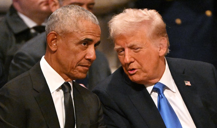 Barack Obama speaks with Donald Trump at the Washington National Cathedral.